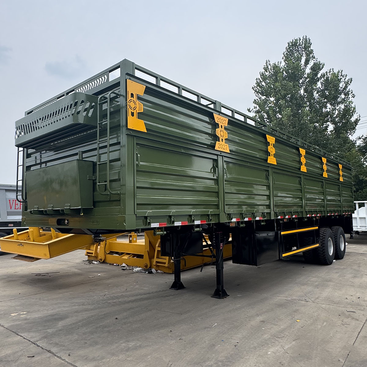 Grain transportation self dumping semi-trailer